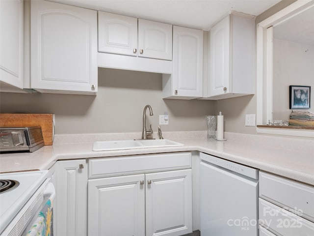 kitchen featuring a sink, white cabinetry, and dishwasher