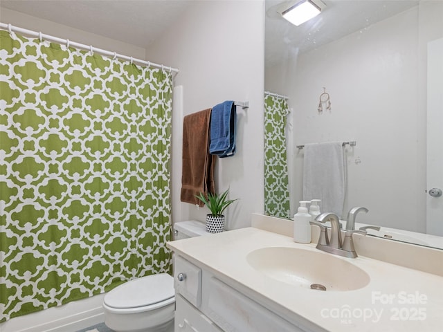 full bath featuring toilet and vanity