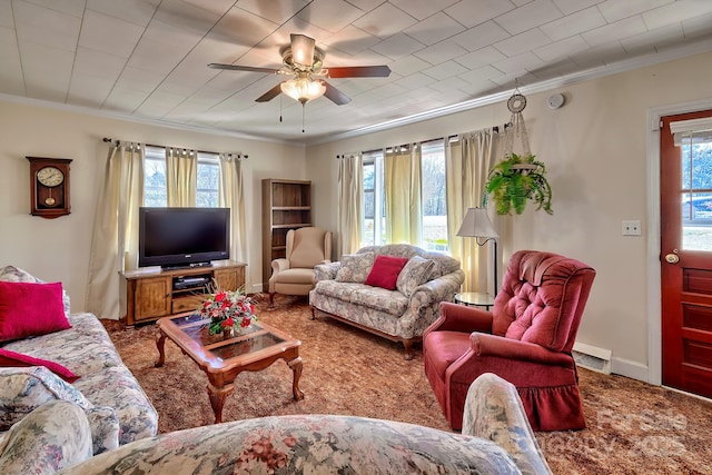 living room with plenty of natural light, visible vents, and crown molding