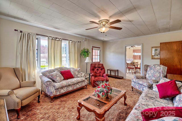 living room featuring carpet and crown molding