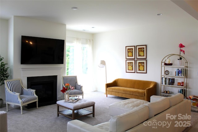 living room with light carpet, a fireplace, and recessed lighting