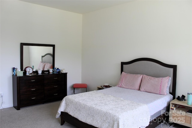 bedroom featuring light carpet