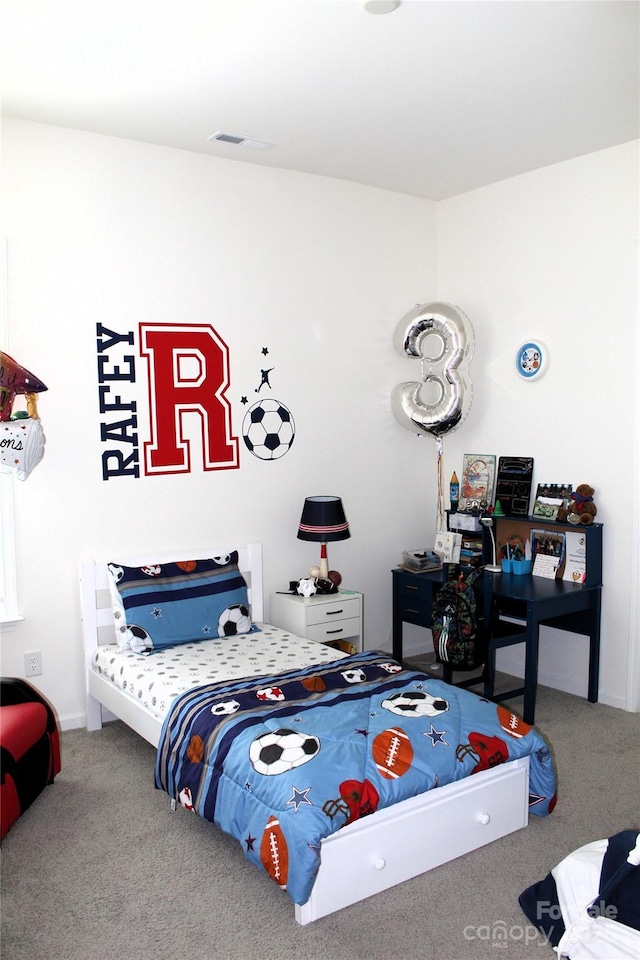 carpeted bedroom with visible vents