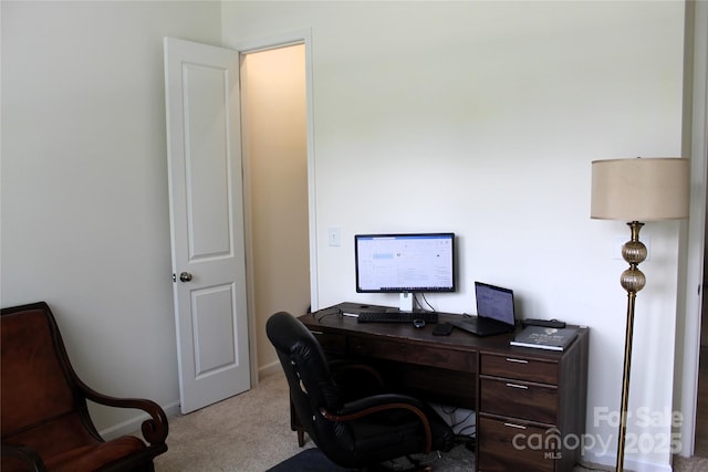 office featuring light carpet and baseboards