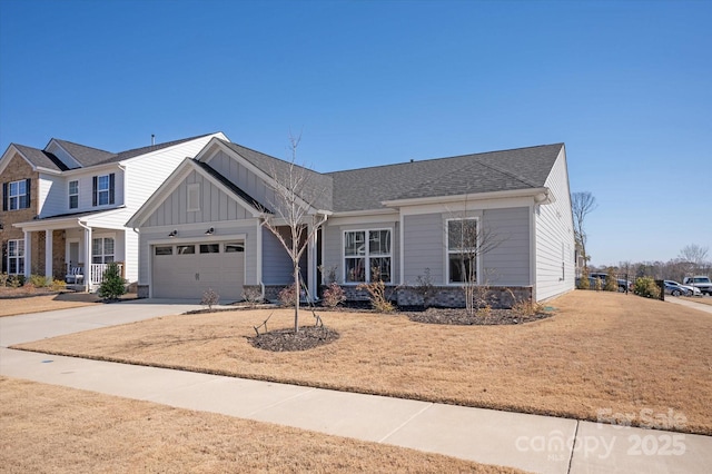 view of front facade with a garage, board and batten siding, and concrete driveway