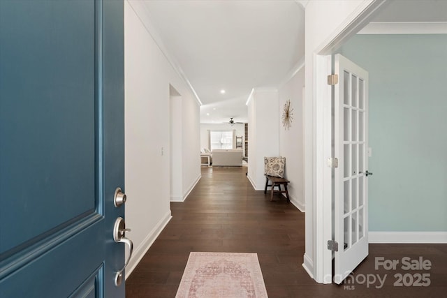 foyer featuring dark wood-style floors, recessed lighting, and baseboards