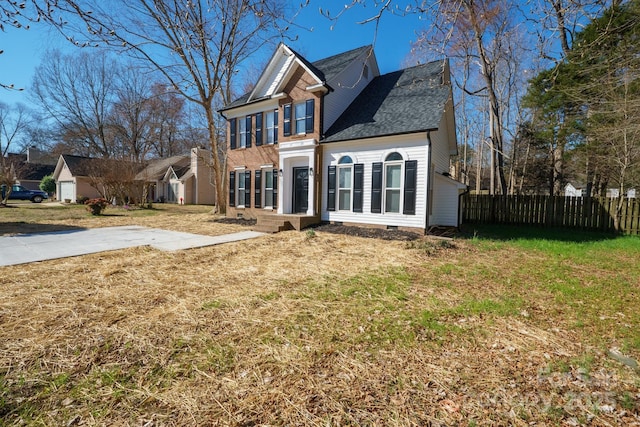 view of front of house with crawl space, fence, and a front yard