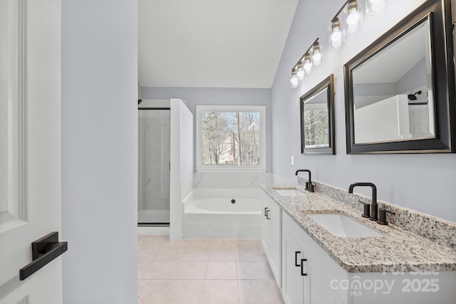 full bathroom featuring tile patterned floors, a sink, a shower stall, and a bath