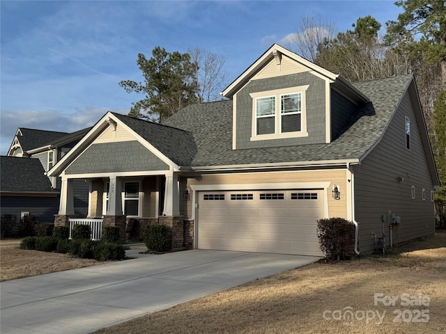 craftsman inspired home featuring concrete driveway, a porch, and roof with shingles