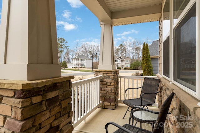 balcony with a porch and a residential view