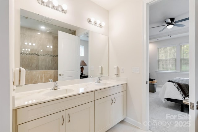 full bathroom with double vanity, walk in shower, a sink, and ensuite bathroom