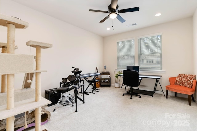 carpeted office space featuring ceiling fan, visible vents, and recessed lighting