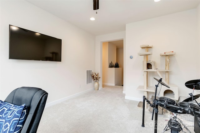 carpeted office space featuring recessed lighting, visible vents, and baseboards