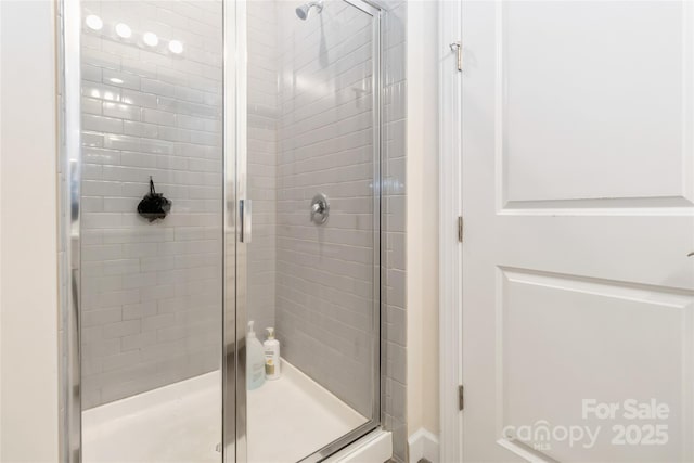 full bathroom featuring a shower stall