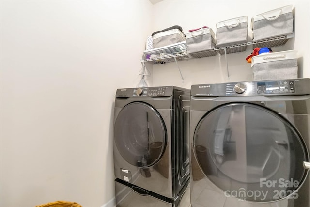 laundry room featuring laundry area, tile patterned floors, and independent washer and dryer