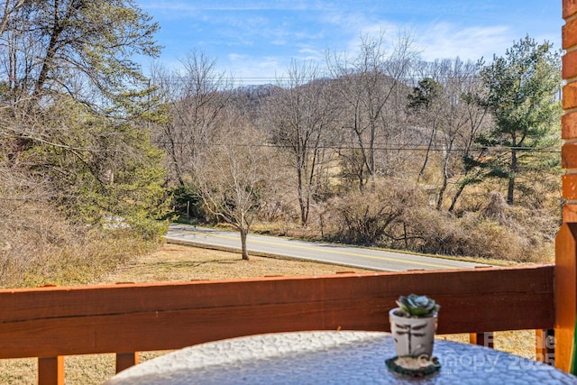 exterior space featuring a forest view