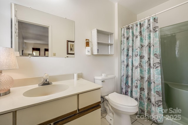 bathroom featuring toilet, a shower with curtain, tile patterned floors, and vanity