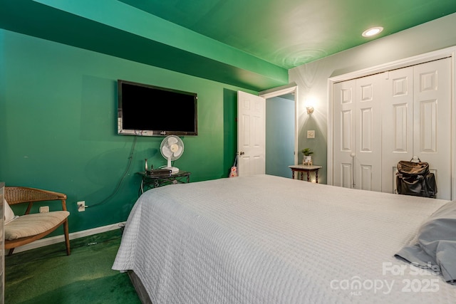 bedroom featuring baseboards, a closet, and recessed lighting