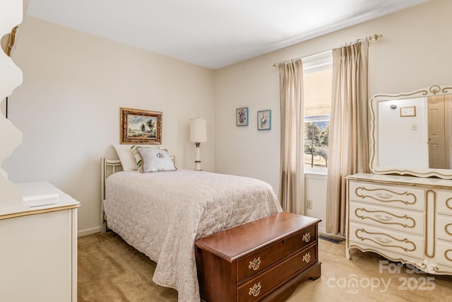 bedroom featuring light colored carpet