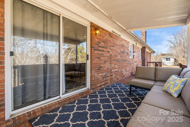 exterior space featuring an outdoor living space