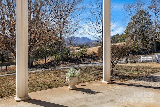 view of yard with a patio area and a mountain view