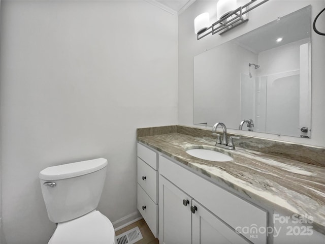 full bath with visible vents, toilet, ornamental molding, vanity, and walk in shower