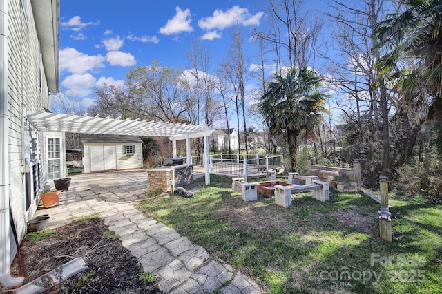 view of yard featuring a patio, a vegetable garden, and a pergola