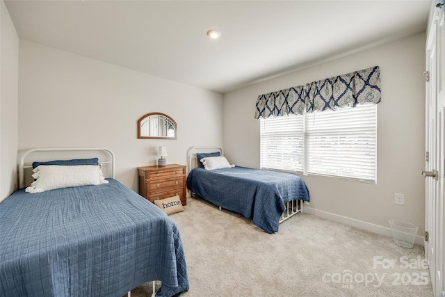 carpeted bedroom with baseboards