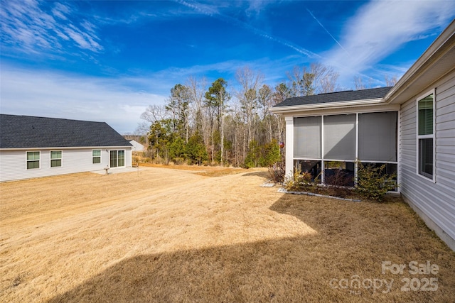 view of yard featuring a sunroom