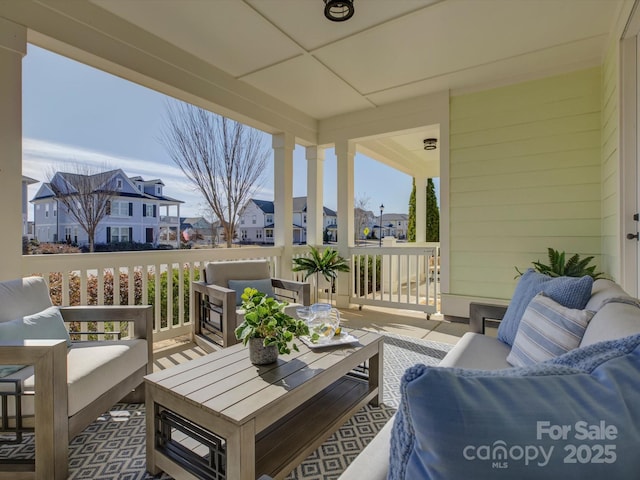 exterior space featuring a residential view and outdoor lounge area