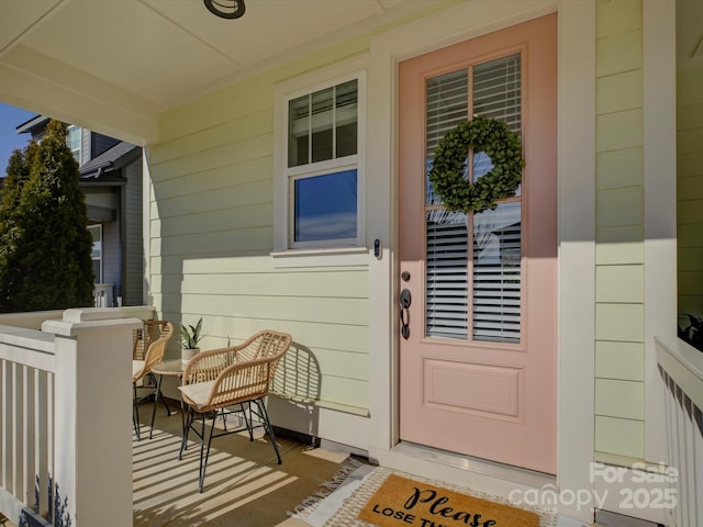 entrance to property featuring a porch