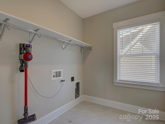 laundry area featuring washer hookup, laundry area, and baseboards