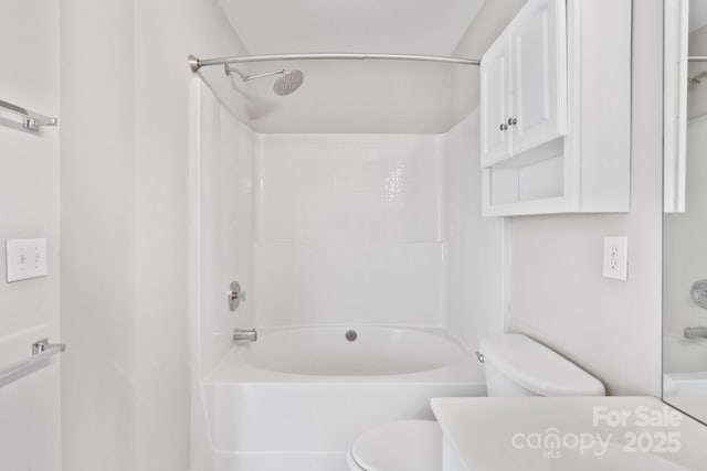 bathroom with  shower combination, vanity, and toilet