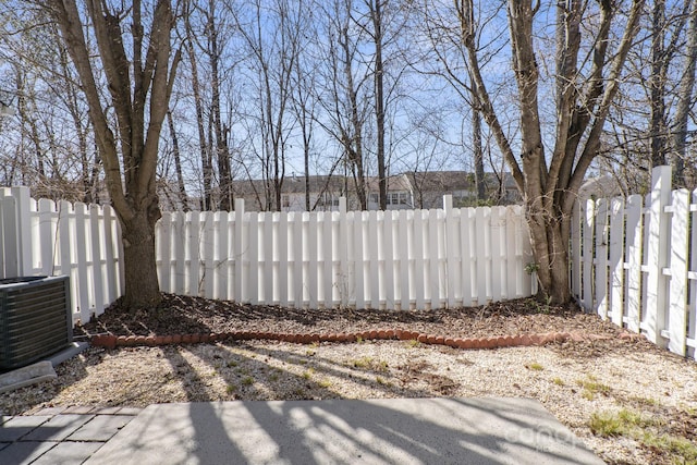 view of yard with cooling unit and a fenced backyard