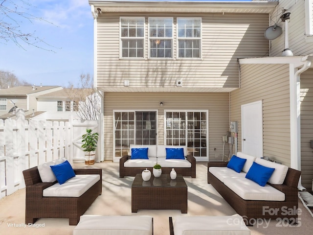 exterior space featuring fence and outdoor lounge area