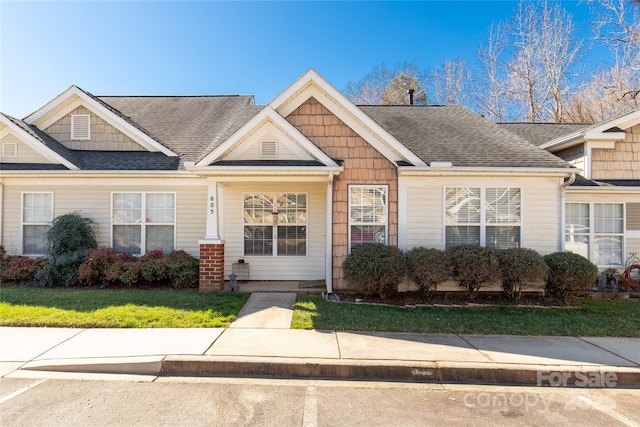 view of front of house with a shingled roof