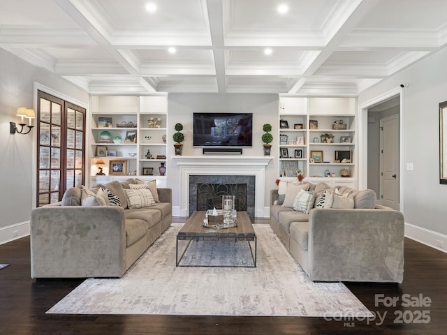 living area featuring coffered ceiling, baseboards, dark wood-style flooring, and beamed ceiling