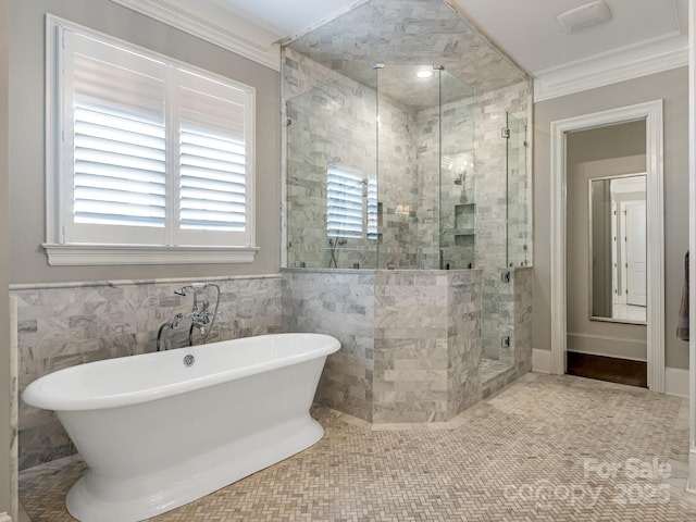 full bathroom with a soaking tub, a shower stall, crown molding, and tile patterned floors