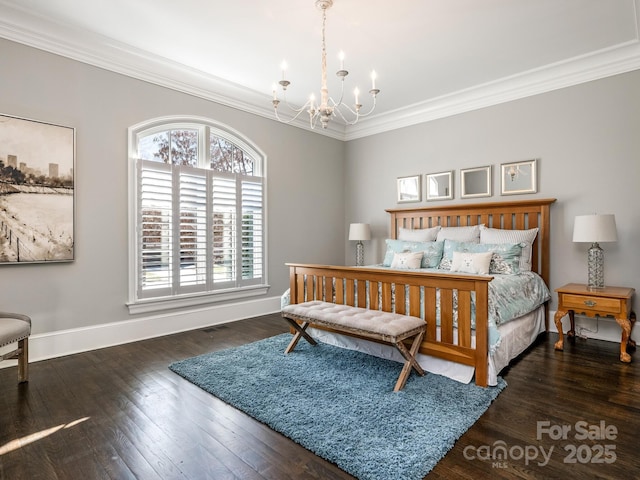 bedroom featuring an inviting chandelier, crown molding, baseboards, and hardwood / wood-style floors