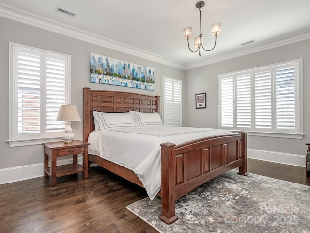 bedroom featuring dark wood-style floors, ornamental molding, baseboards, and an inviting chandelier