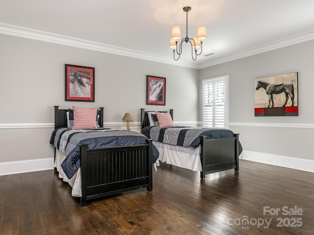 bedroom featuring ornamental molding, baseboards, an inviting chandelier, and wood finished floors