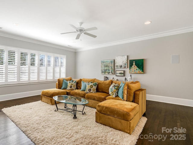 living room featuring baseboards, dark wood finished floors, and crown molding