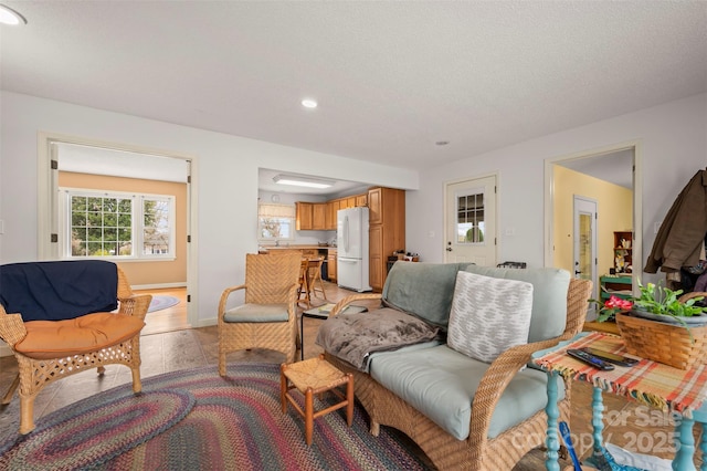 living room featuring light wood finished floors and baseboards