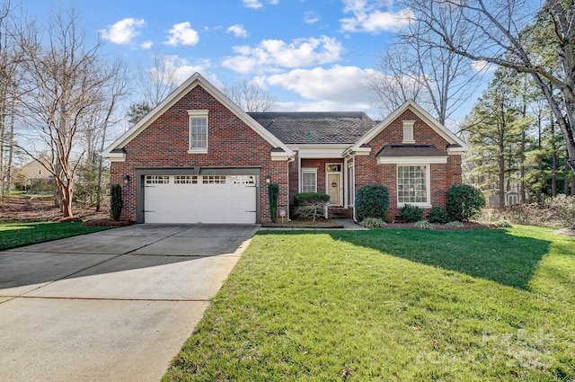 traditional-style house with brick siding, a shingled roof, concrete driveway, and a front yard