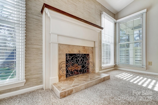 interior details featuring carpet and a fireplace