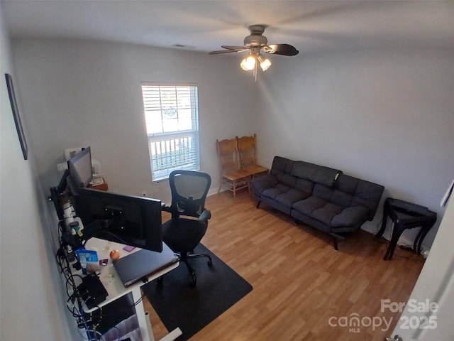 office featuring a ceiling fan and light wood-type flooring