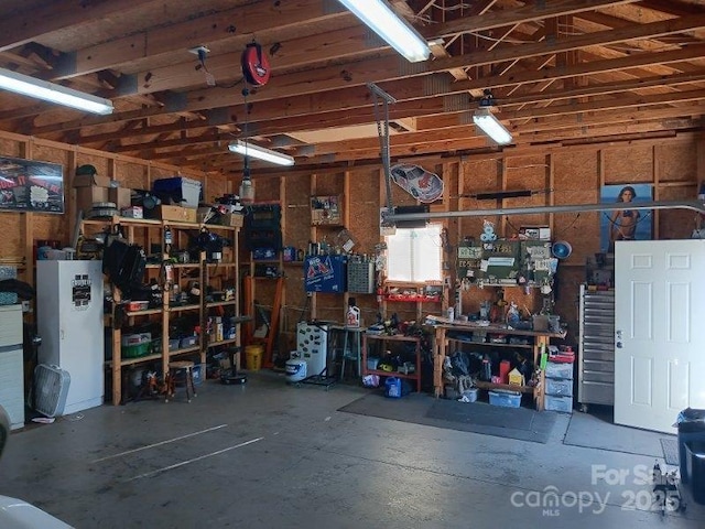 garage with a workshop area