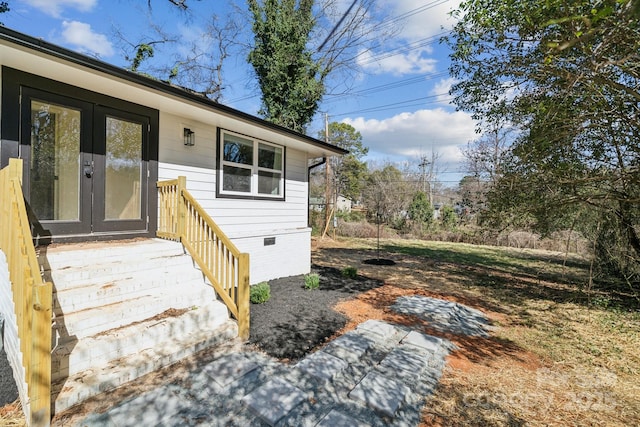 property entrance with crawl space and french doors