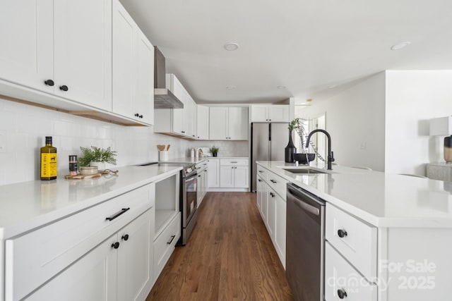 kitchen with dark wood-style floors, light countertops, backsplash, appliances with stainless steel finishes, and white cabinets