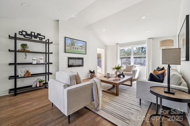 living room with a fireplace, vaulted ceiling, dark wood-style flooring, and recessed lighting